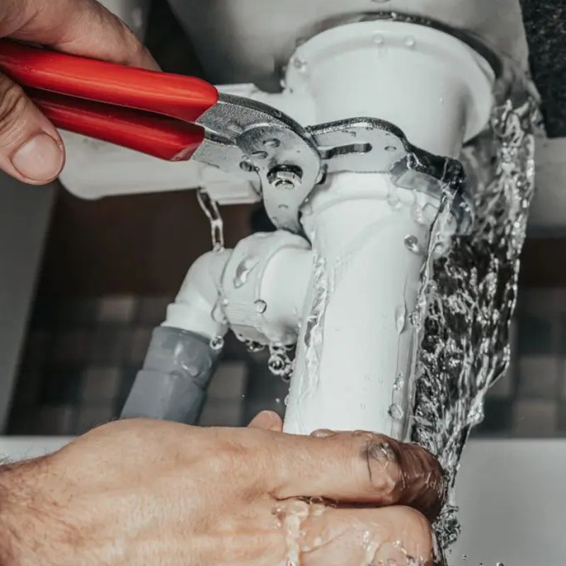 Professional plumbing team working on site